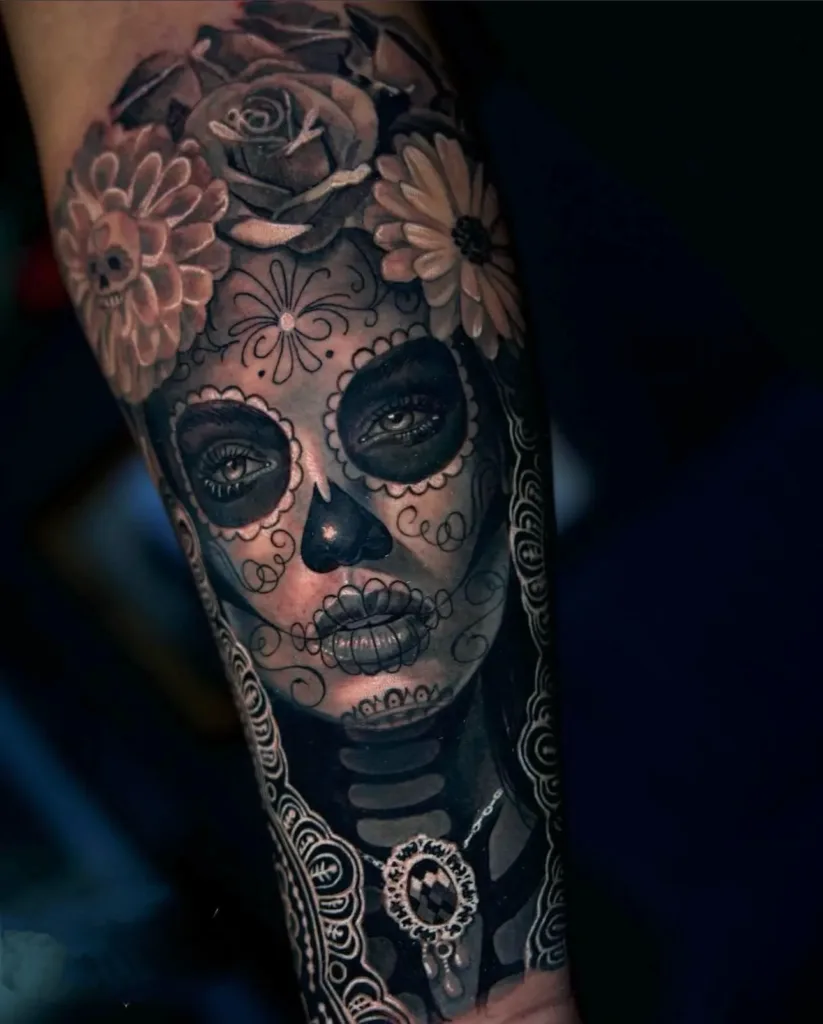 a tattoo of a woman with flowers on her face showcasing black and gray tattoo in Tampa, FL