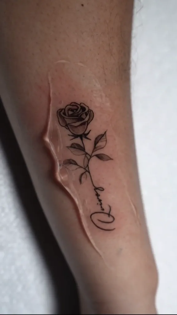 an image of a rose tattooed on an arm showcasing fine line tattoo in Miami