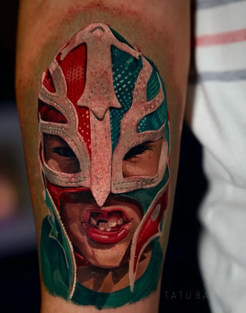 an image of rey mysterio tattooed on a man's arm showcasing a realism tattoo artist in Tampa