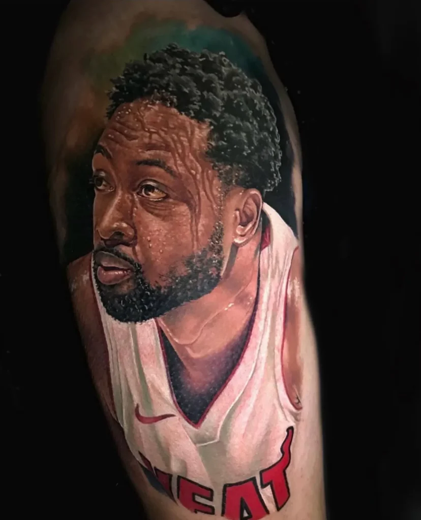 expertly inked realism tattoo of Dwayne wade on an arm showcasing the skill of portrait tattoo artist in Tampa, FL